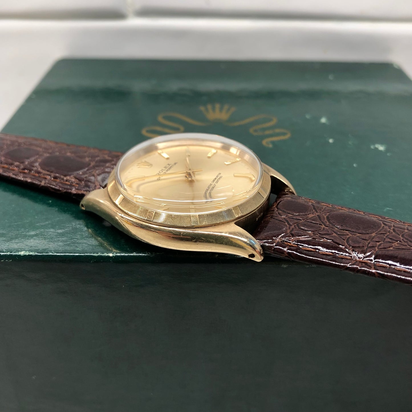 1961 Rolex Oyster Perpetual 1003 9k Yellow Gold English Chronometer Engine Turned Wristwatch - HASHTAGWATCHCO