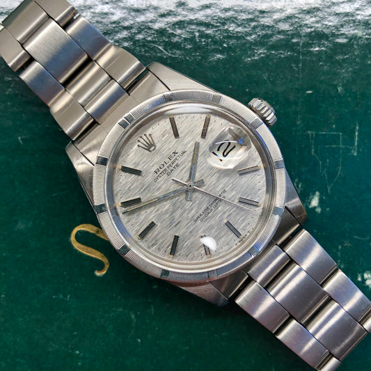 1975 Rolex Date 1501 Steel Engine Turned Oyster Silver Mosaic Dial Wristwatch
