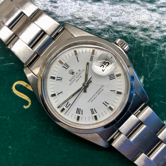 1976 Rolex Date 1500 Oyster Perpetual White Roman Steel Automatic Wristwatch - HASHTAGWATCHCO