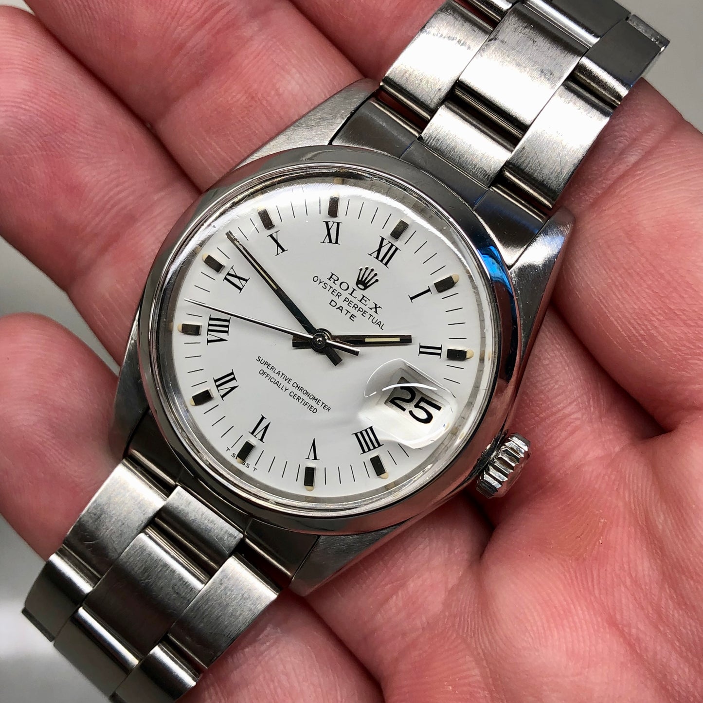 1976 Rolex Date 1500 Oyster Perpetual White Roman Steel Automatic Wristwatch - HASHTAGWATCHCO