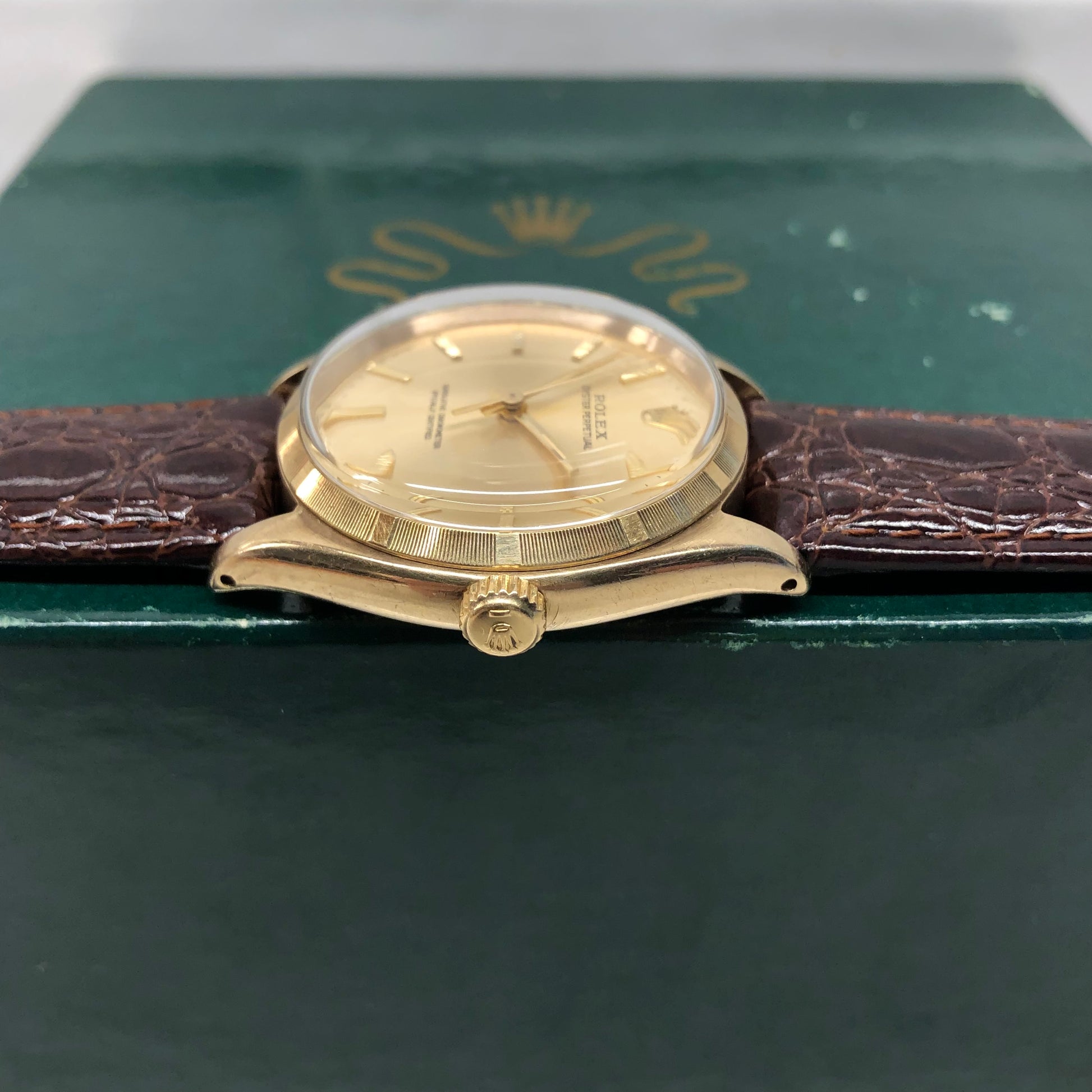 1961 Rolex Oyster Perpetual 1003 9k Yellow Gold English Chronometer Engine Turned Wristwatch - HASHTAGWATCHCO