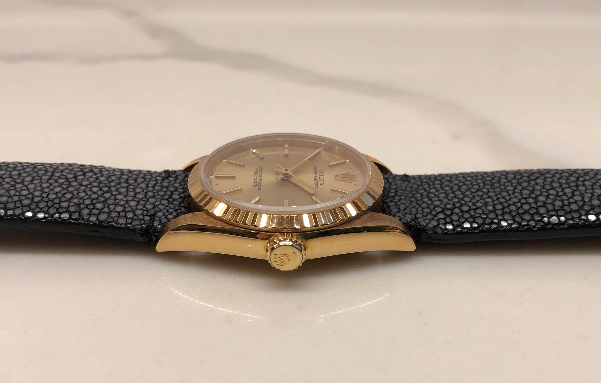 1989 Rolex Oyster Perpetual 67518 Champagne Dial 18K Yellow Gold Wristwatch - HASHTAGWATCHCO