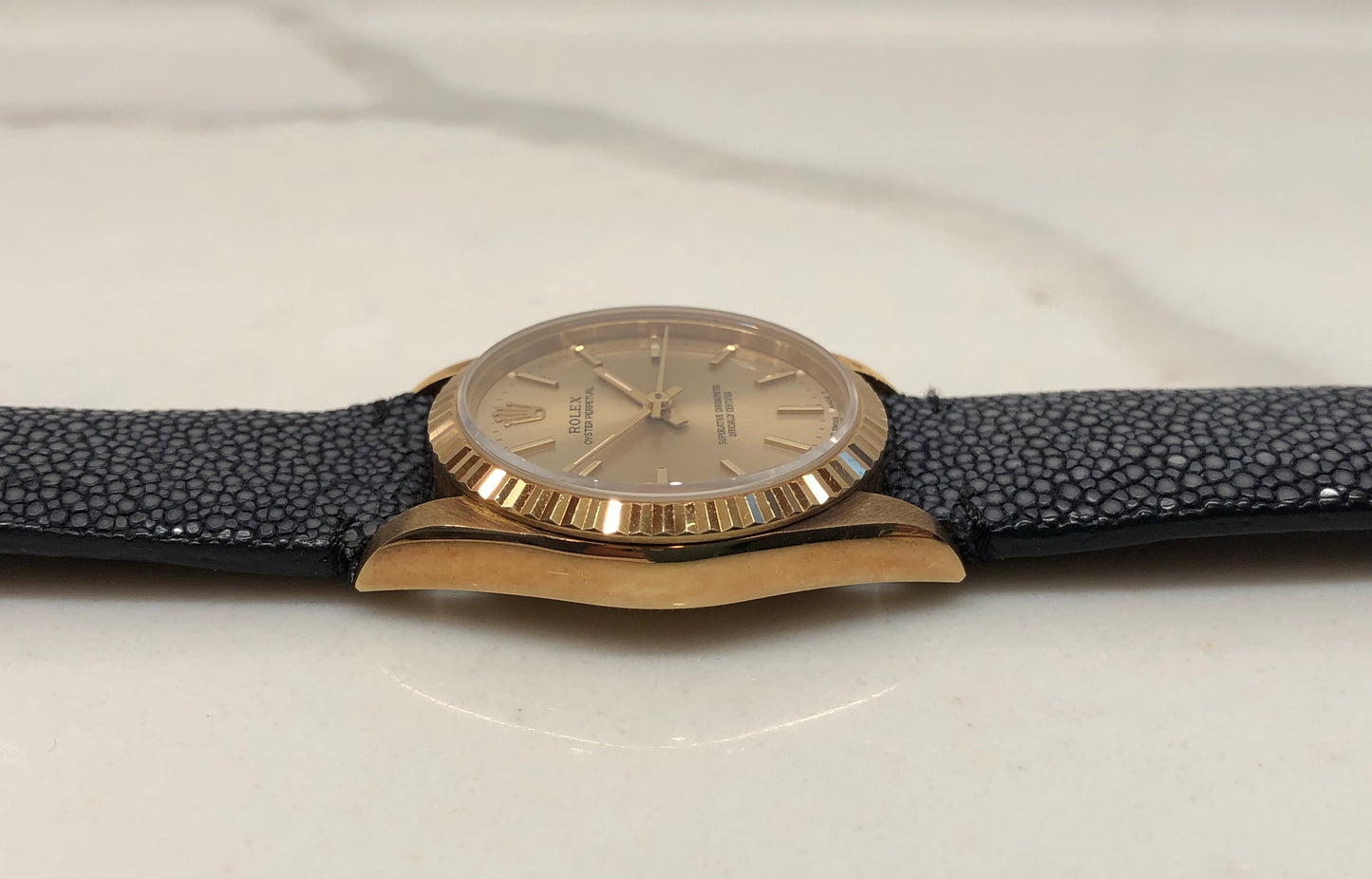 1989 Rolex Oyster Perpetual 67518 Champagne Dial 18K Yellow Gold Wristwatch - HASHTAGWATCHCO