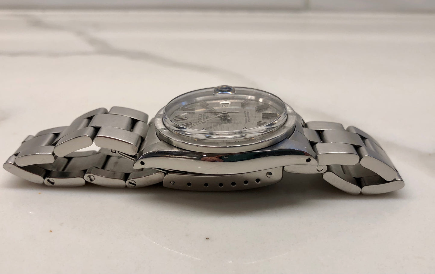 1975 Rolex Date 1501 Steel Engine Turned Oyster Silver Mosaic Dial Wristwatch