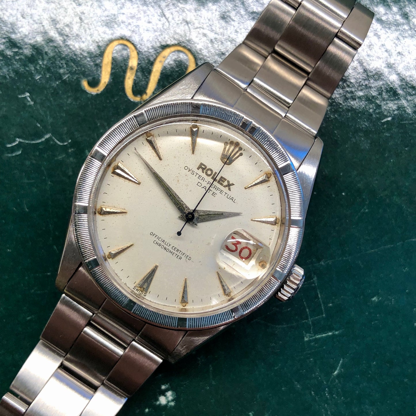 1958 Rolex Date 6535 Steel Engine Turned Oyster Roulette Wheel Automatic Wristwatch