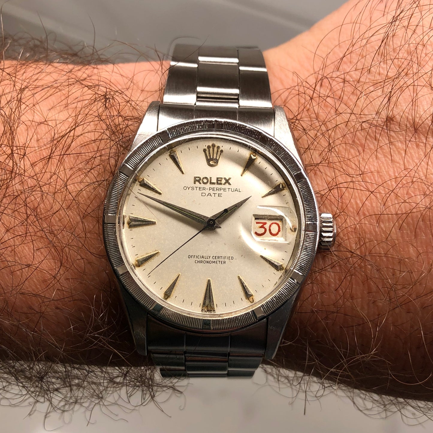 1958 Rolex Date 6535 Steel Engine Turned Oyster Roulette Wheel Automatic Wristwatch