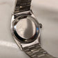 1958 Rolex Date 6535 Steel Engine Turned Oyster Roulette Wheel Automatic Wristwatch