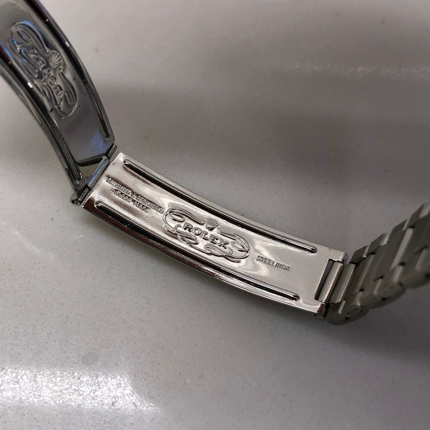 1958 Rolex Date 6535 Steel Engine Turned Oyster Roulette Wheel Automatic Wristwatch